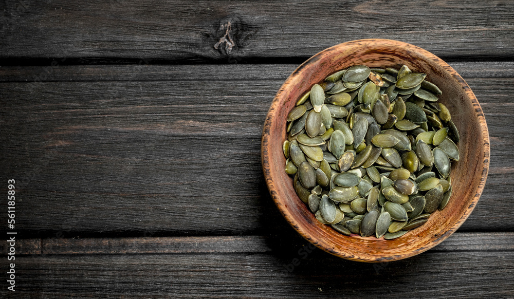 Pumpkin seeds in bowl. Pumpkin seeds in bowl.