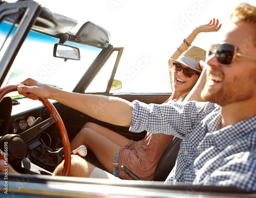 Car road trip, travel and laughing couple on bonding holiday adventure, transportation journey or fun summer vacation. Love flare, convertible automobile and driver driving on Canada countryside tour