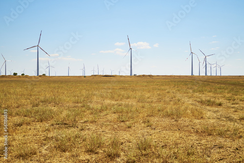 wind farm in the steppe against the blue sky