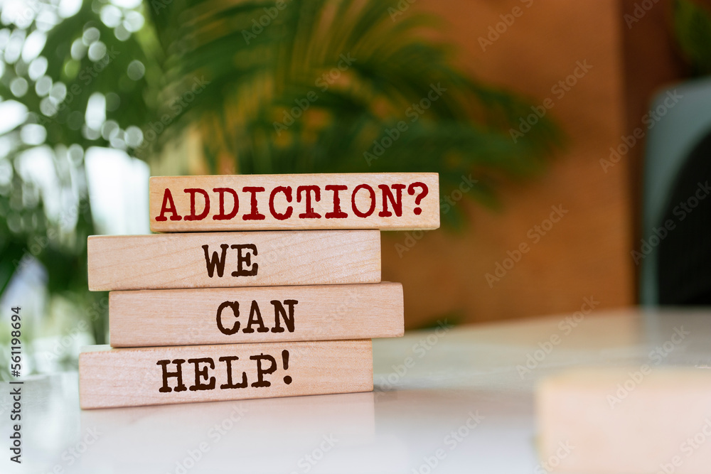 Wooden blocks with words 'Addiction? We can help!'. - obrazy, fototapety, plakaty 