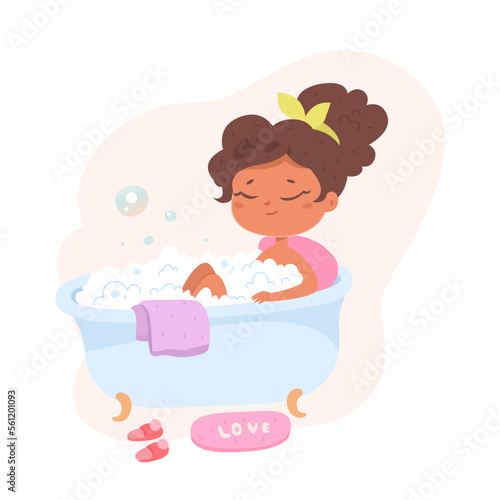 Baby child sitting in bathtub with hot water and soap foam, cute little girl taking bath