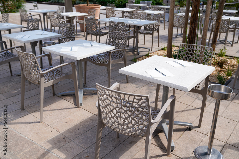 Charming design grey modern chairs on cafe outdoor restaurant coffee and marble tables terrace