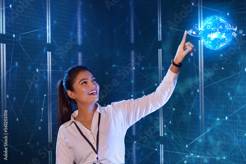 Female Technician touching on digital globe screen, future technology concept