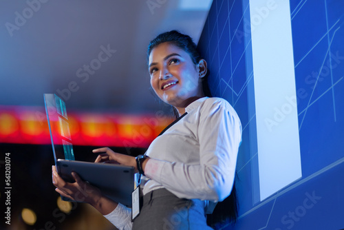 Female Technician working on the server in the data storage room photo