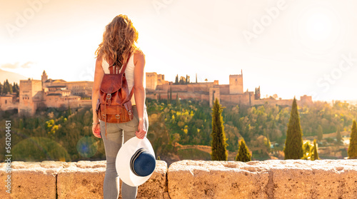 Woman tourist looking at Ancient arabic fortress Alhambra- Granada in Spain