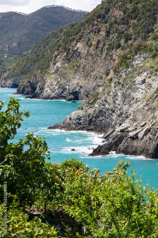 View of the Mediterranean Sea coast, turquoise water and surrounding rocks, Cinque Terre, Italy