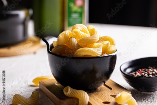 Bowl with pasta before cooking photo