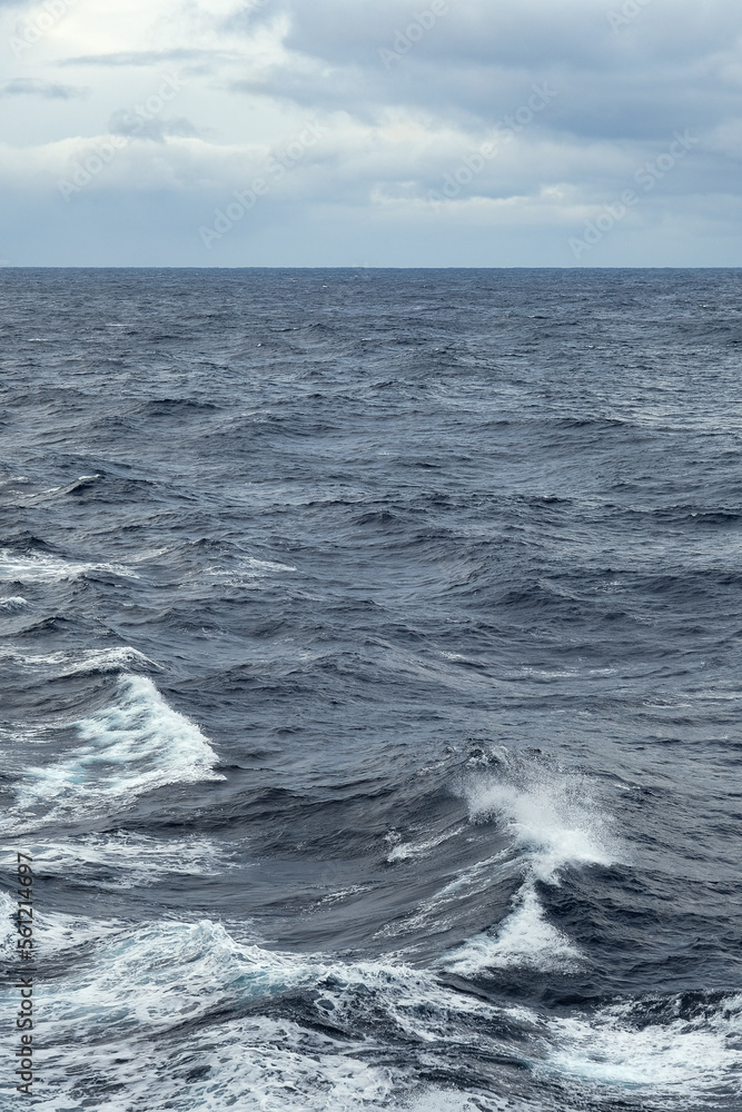 Stormy sea conditions with high swell waves on Atlantic Ocean during transatlantic passage crossing on ocean liner