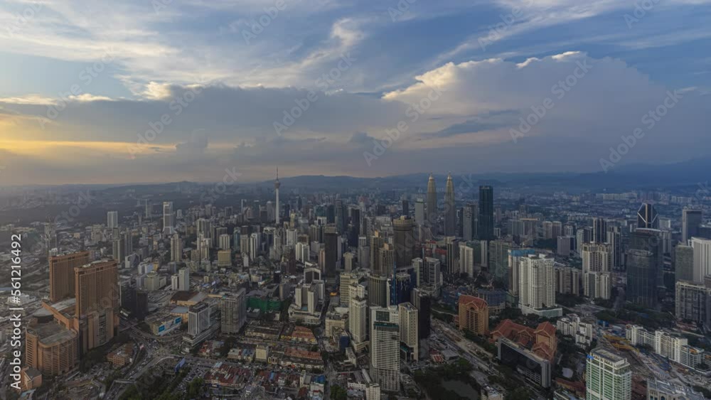 Aerial day-time time lapse overlooking a wide view of a city skyline with dancing rays before sunset in Kuala Lumpur, Malaysia. Prores 4K DCI Aerial day-time time lapse overlooking a wide view of a city skyline with dancing rays before sunset in Kuala Lumpur, Malaysia. Prores 4K DCI
