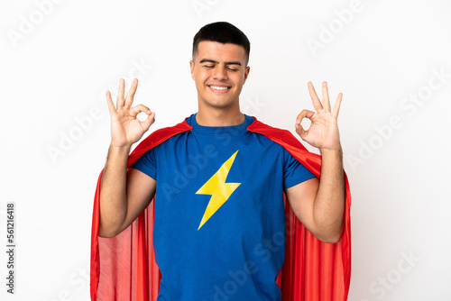 Super Hero over isolated white background in zen pose