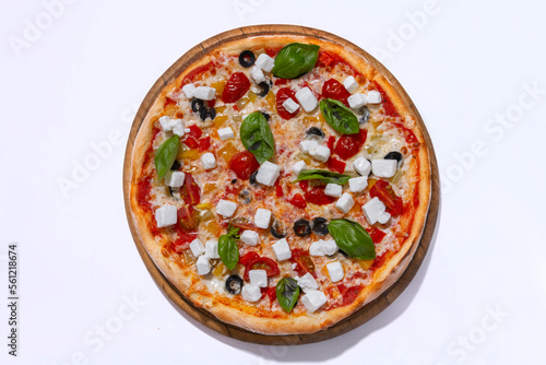 freshly baked pizza with feta cheese slicers on white background