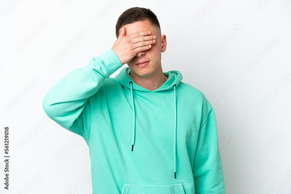 Young brazilian man isolated on white background covering eyes by hands. Do not want to see something Young brazilian man isolated on white background covering eyes by hands. Do not want to see something