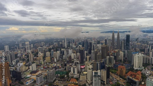 Wallpaper Mural Aerial sunrise time lapse overlooking a wide view of a city skyline with dancing rays before sunset in Kuala Lumpur, Malaysia. Pan right motion timelapse. Prores 4K DCI Torontodigital.ca