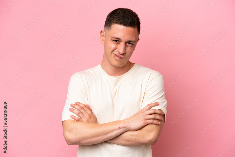 Obraz premium Young Brazilian man isolated on pink background feeling upset