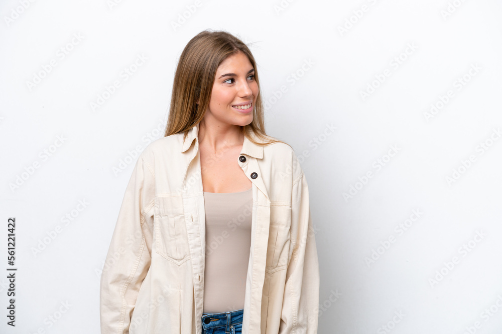 Young caucasian woman isolated on white bakcground looking to the side and smiling Young caucasian woman isolated on white bakcground looking to the side and smiling