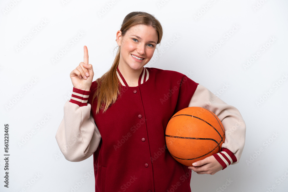 Young basketball player woman isolated on white background showing and lifting a finger in sign of the best Young basketball player woman isolated on white background showing and lifting a finger in sign of the best