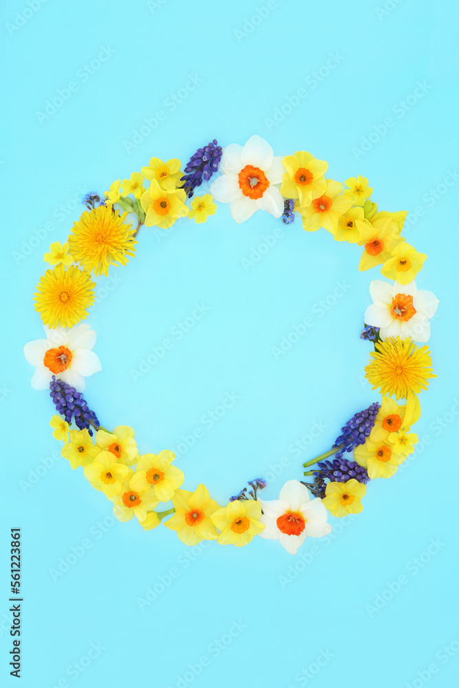 Natural Spring and Easter abstract flower wreath. Minimal creative fresh floral nature composition for Springtime and Mothers Day on pastel blue background. Copy space, flat lay.