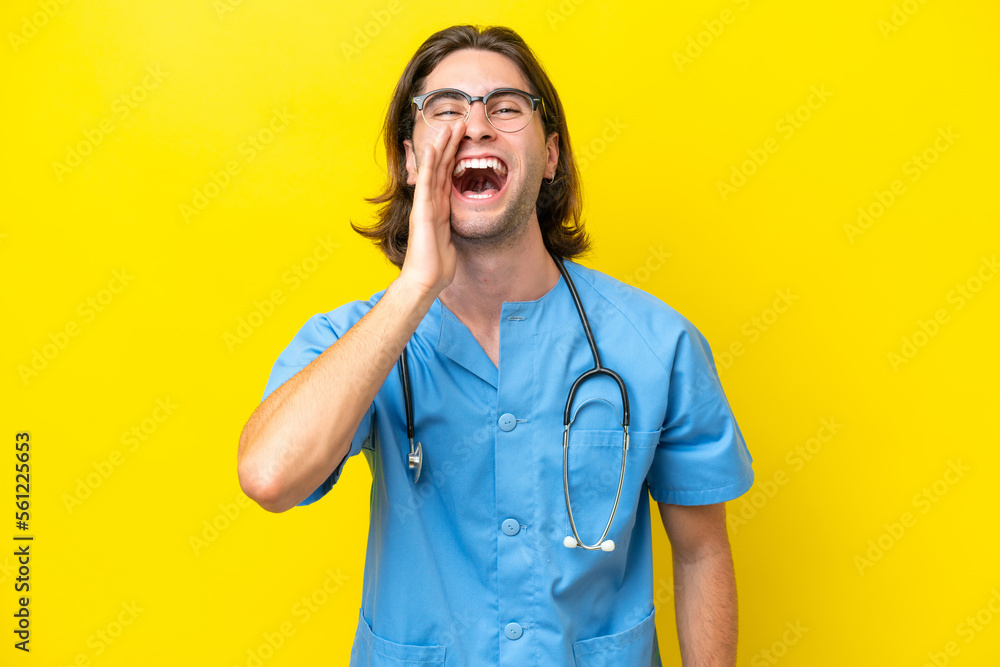 Young surgeon caucasian man isolated on yellow background shouting with mouth wide open Young surgeon caucasian man isolated on yellow background shouting with mouth wide open