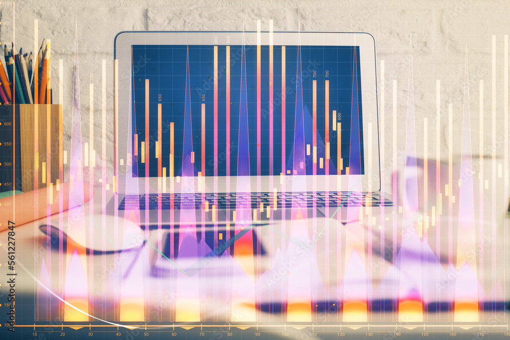 Forex market graph hologram and personal computer on background. Multi exposure. Concept of investment. Forex market graph hologram and personal computer on background. Multi exposure. Concept of investment.