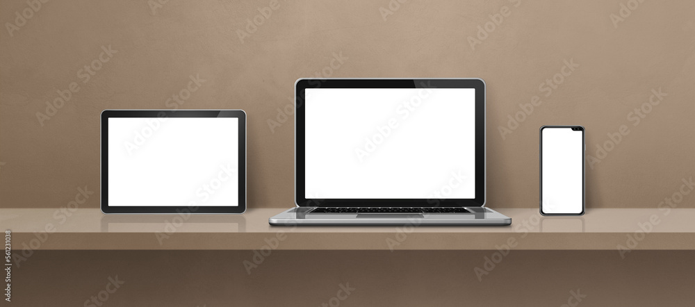 Laptop, mobile phone and digital tablet pc on brown wall shelf. Banner background Laptop, mobile phone and digital tablet pc on brown wall shelf. Banner background