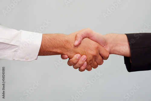 handshake to make a business deal on a white background.
