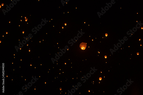 Low angle view of illuminated lanterns flying against sky during Chinese New Year at night