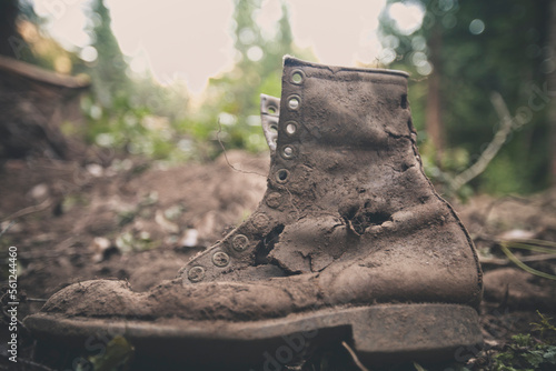 Old weathered leather work boot that was uncovered during a recent excavation. photo