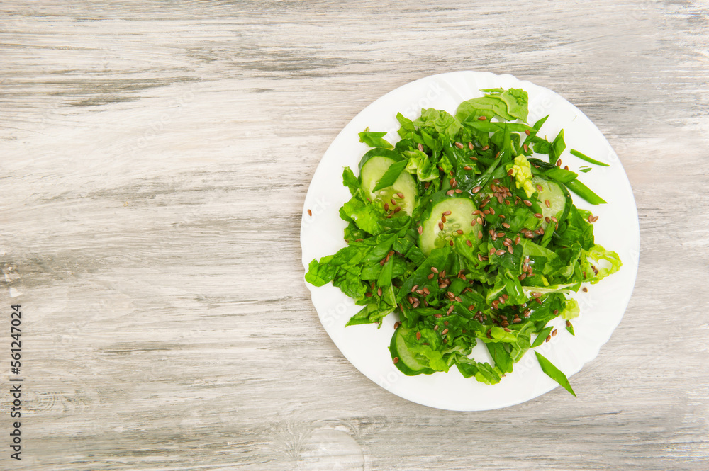 Fresh green salad on plate top view Fresh green salad on plate top view