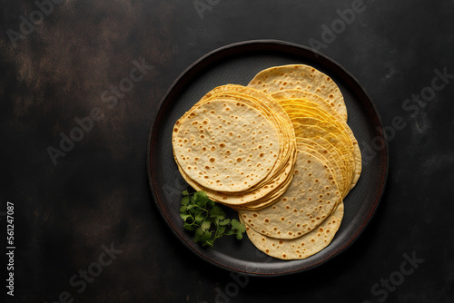 Top view of a plate with corn tortillas on a gray background. Lebanese bread. Generative AI photo