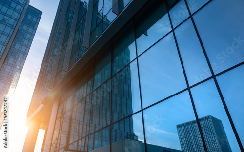 Sunset reflected off modern glass facades of skyscrapers in the financial center of the city