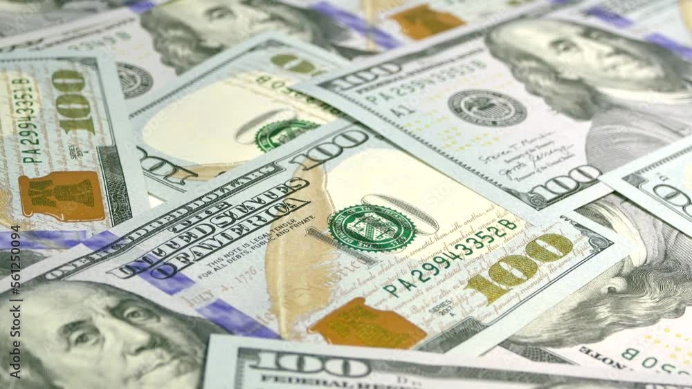Lots of money. Dollar bill close-up. Income, capital and wealth. Enrichment with 100 US dollar bills. Bank savings Lots of money. Dollar bill close-up. Income, capital and wealth. Enrichment with 100 US dollar bills. Bank savings