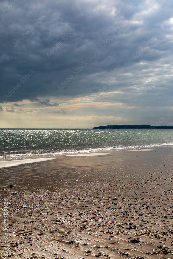 Looking towards the headland at Fairlight Cove, from Camber Sands in Sussex