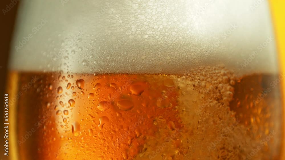 Super slow motion of macro shot of beer drink bubbling, close-up. Filmed on high speed cinema camera, 1000 fps. Super slow motion of macro shot of beer drink bubbling, close-up. Filmed on high speed cinema camera, 1000 fps.