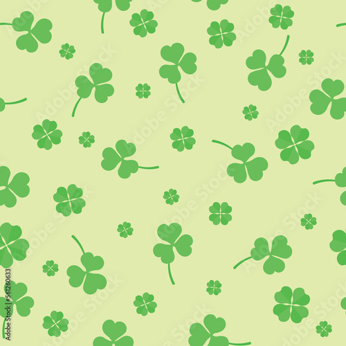 Many clover leaves on beige background. Pattern for St. Patrick s Day