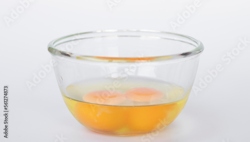 Raw eggs in a glass cup