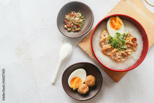 congee porridge with chicken slice, tofu, egg. congee porridge from hong kong. chinese food