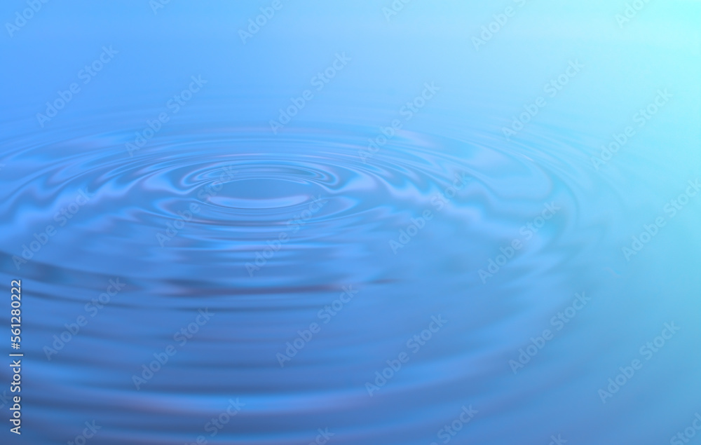 Waves of water are caused by falling droplets. close-up view. Waves of water are caused by falling droplets. close-up view.