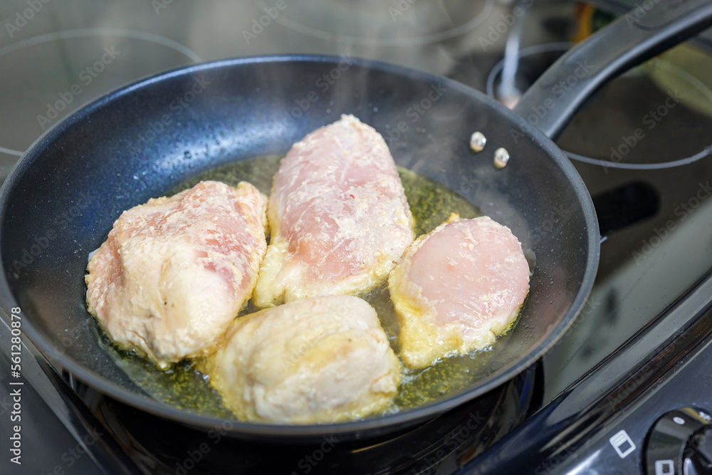 Chicken breast fillets frying in a pan Chicken breast fillets frying in a pan
