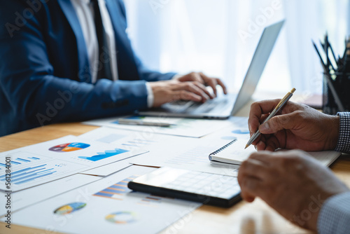 Portrait of a young Asian businessman calculating numbers and doing details and clarifying information. For investment in real estate projects planning ideas financial.