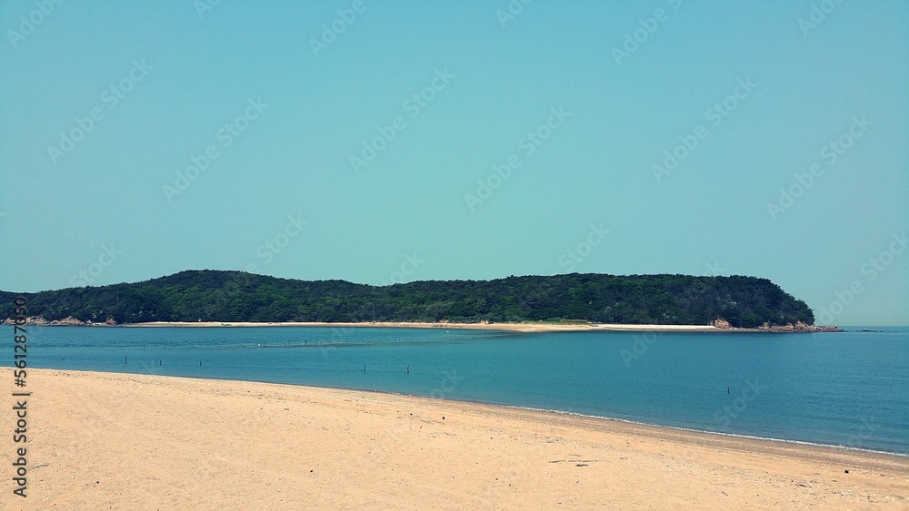 a sandy blue beach
