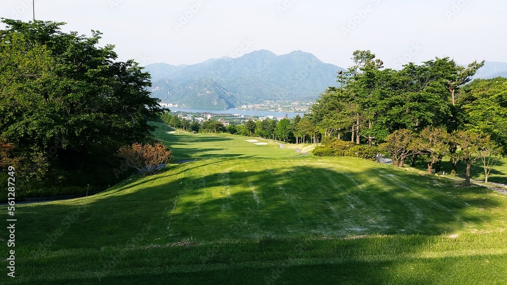 a golf course with beautiful green grass