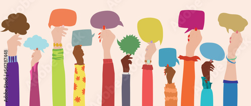 The group of multi-ethnic multicultural women holds a speech bubble in hand as they raise their arms to symbolize diversity.