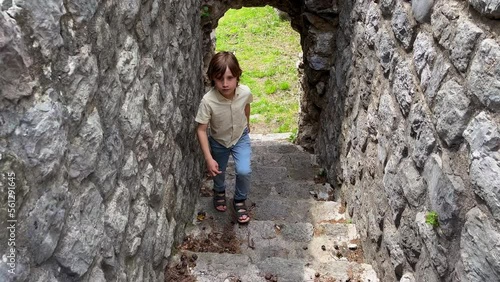 Slowmotion video. A young woman and her son visit the ruins of the Bar old city or Stari Grad. A destroyed ancient settlement close to the city of Bar. Travel destinations of Montenegro photo