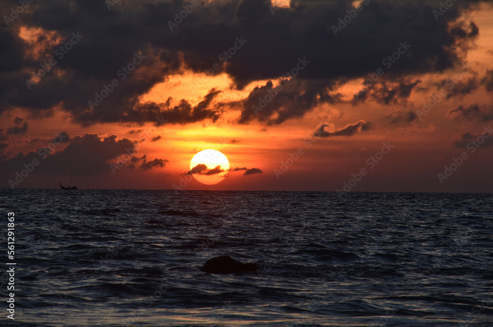 The Sunrise in the cloudy sea