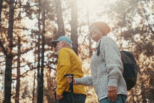 Portrait close up head shot of one cheerful smiling middle age woman walking with her husband enjoying free time and nature. Active beautiful seniors in love together at sunny day.