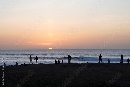 people watching the sunset on the beach, playa de las americas tenerife photo