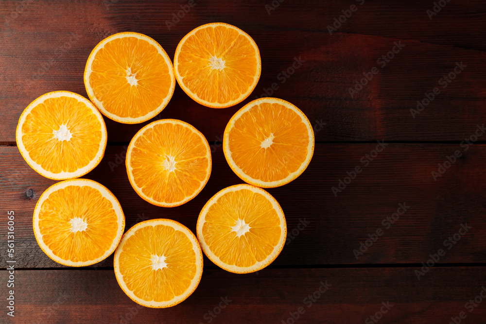 Halves of oranges on a wooden boards. Juicy orange halves for making juice on a wooden table. Copy space Halves of oranges on a wooden boards. Juicy orange halves for making juice on a wooden table. Copy space