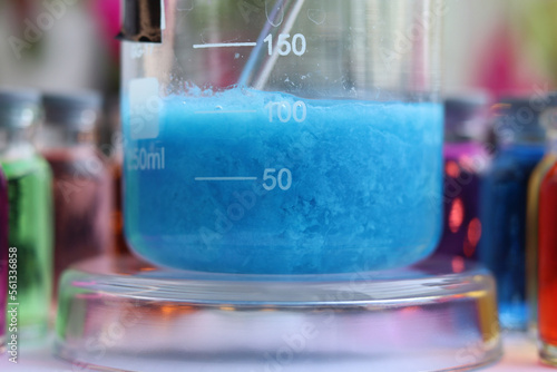 Konstfotografi Blue insoluble substance of mineral origin - copper silicate in a beaker