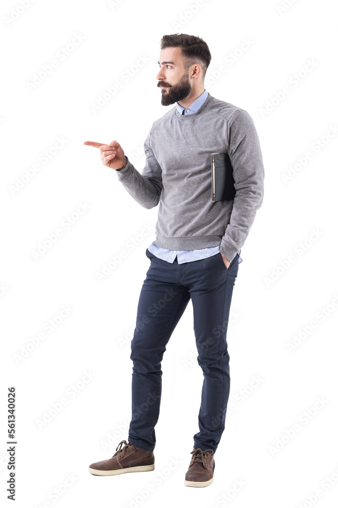 Confident young business man with documents pointing finger at copyspace. Full body length portrait isolated on transparent background. Confident young business man with documents pointing finger at copyspace. Full body length portrait isolated on transparent background.