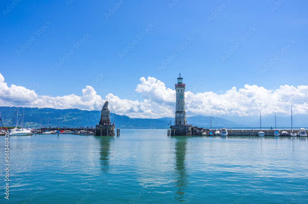 Harbour entrance of Lindau in Lake Constance, Bavaria, Germany, flanked by the Bavarian Lion and Lighthouse, the landmarks of Lindau.